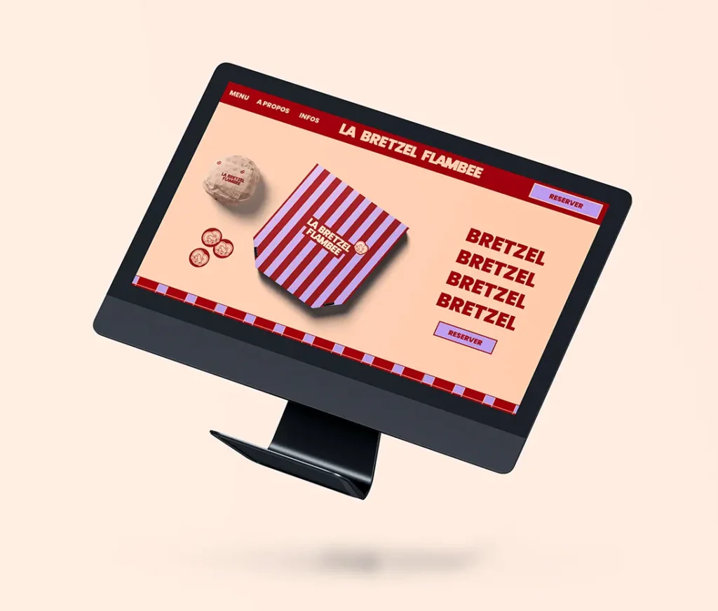 Mockup d'un site internet pour La Bretzel Flambée sur un écran d'ordinateur